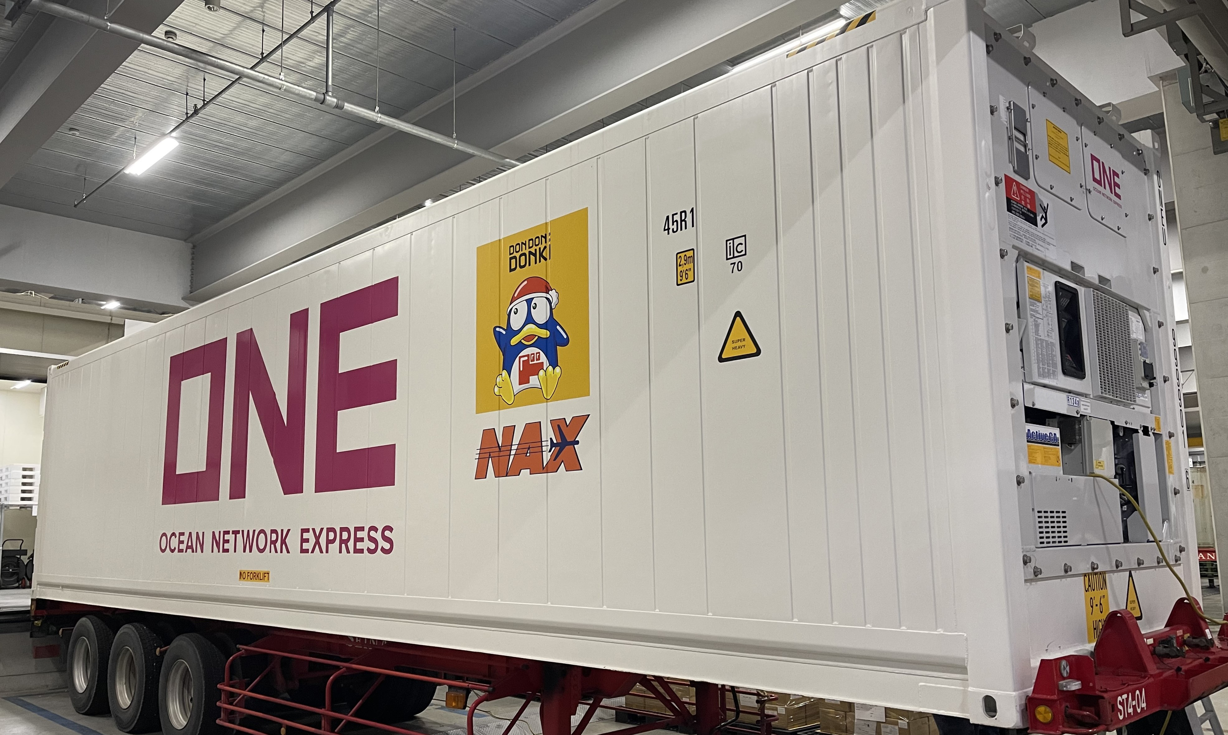 CA container labelled with “Donpen”, the official mascot of Don Quijote and the NAX logo